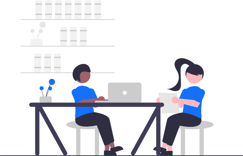 Two people working at a desk with a laptop and documents, symbolizing Expert Regulatory Support and collaboration